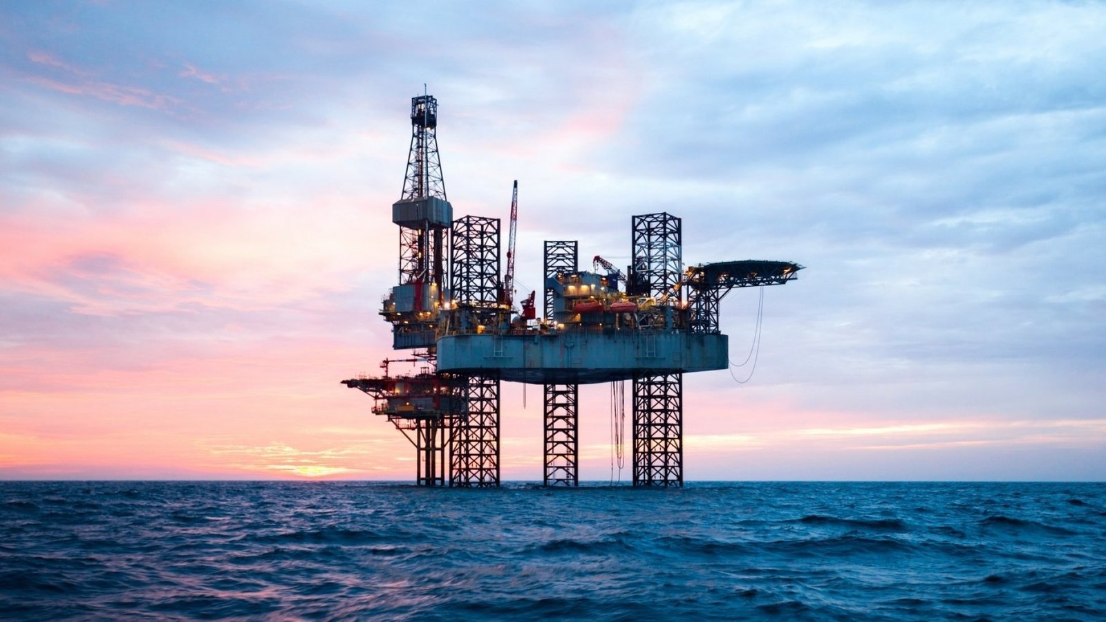 Offshore oil rig at sunset, no relation to stainless steel suppliers in Pune.