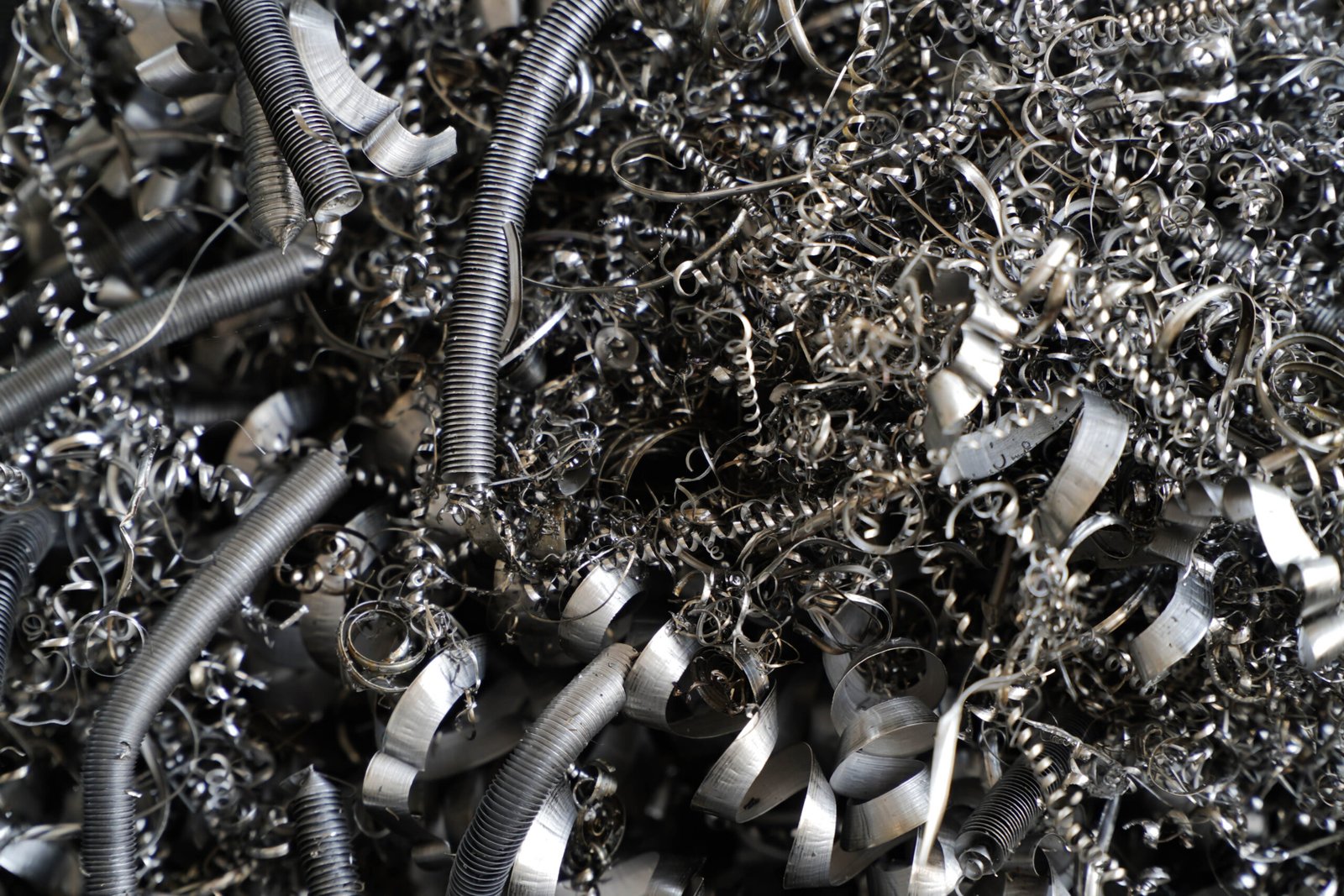 Metal coils and strips, showcasing industrial material processing.
